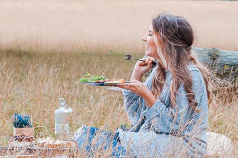 A girl enjoying picnic during hay fever allergy season